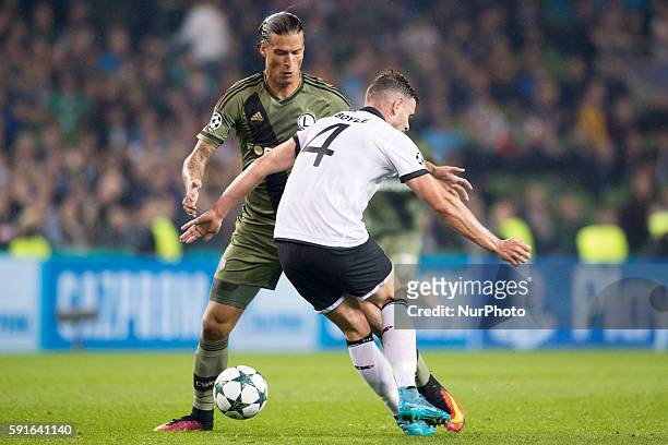 Aleksandar Prijovic of Legia and Andy Boyle of Dundalk fight for the ball during the UEFA Champions League Play-Offs 1st leg between Dundalk FC and...