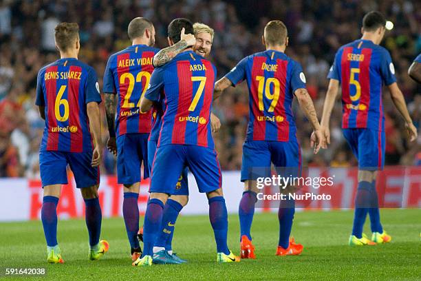 Barcelona's Leo Messi and Arda Turan cellebrating the second scores during the second-leg of the Spanish Super Cup football match between FC...