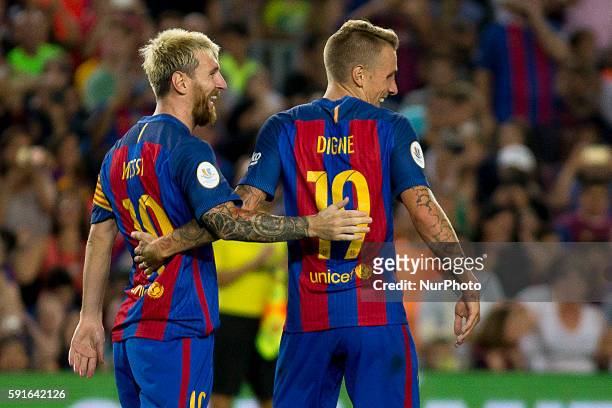 Barcelona's Leo Messi and Digne celleb rating the thord score during the second-leg of the Spanish Super Cup football match between FC Barcelona and...