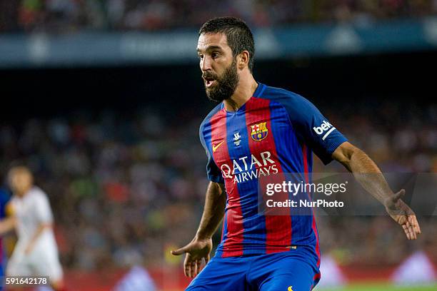 Barcelona's Arda Turan gestures during the second-leg of the Spanish Super Cup football match between FC Barcelona and Sevilla FC at Camp Nou Stadium...