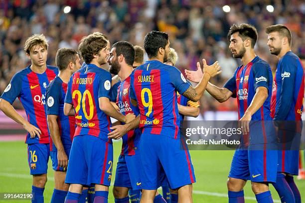 Barcelona's players cellebrating the victory of the Spanish Super Cup football match between FC Barcelona and Sevilla FC at Camp Nou Stadium on...