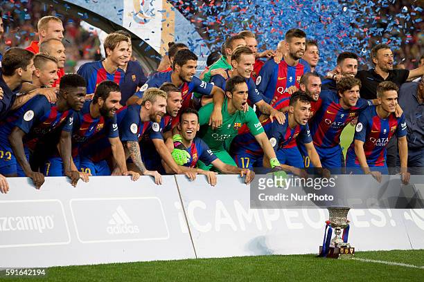 Barcelona's players cellebrating the victory of the Spanish Super Cup football match between FC Barcelona and Sevilla FC at Camp Nou Stadium on...