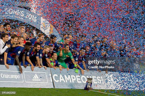 Barcelona's players cellebrating the victory of the Spanish Super Cup football match between FC Barcelona and Sevilla FC at Camp Nou Stadium on...