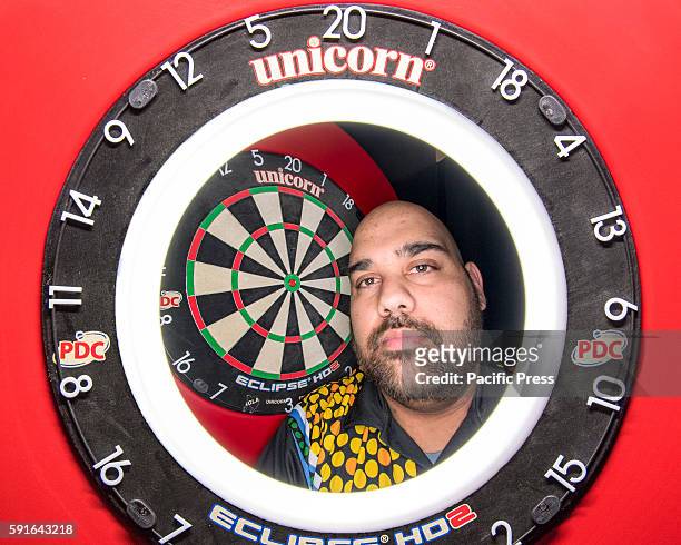 Composite view of Indigenous professional darts player Kyle Anderson and the competition dartboard during a press conference ahead of the Sydney...