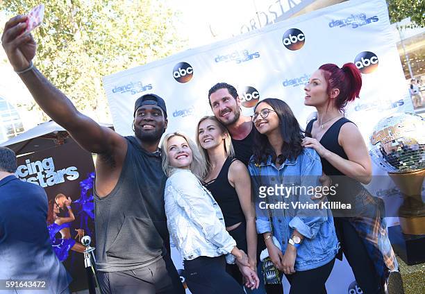 Dancers Keo Motsepe, Witney Carson, Lindsay Arnold, Valentin Chmerkovskiy and Sharna Burgess pose with a fan at The Grove Hosts Dancing With The...
