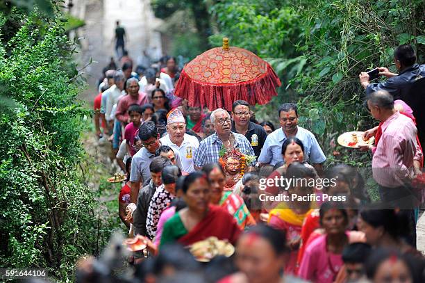 Devotees carrying the idol Bagh Bhairab for the celebration on the occasion of the Bagh Bhairab festival celebrated at Kirtipur, Kathmandu, Nepal on...