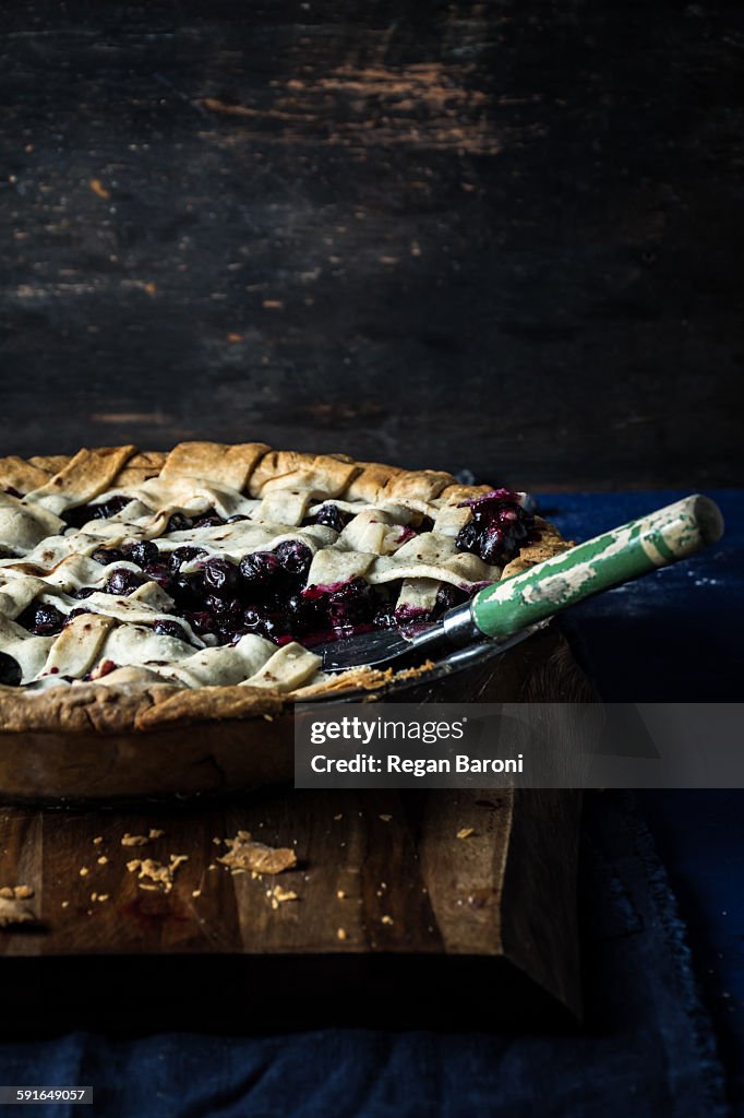 Blueberry pie with mint on table