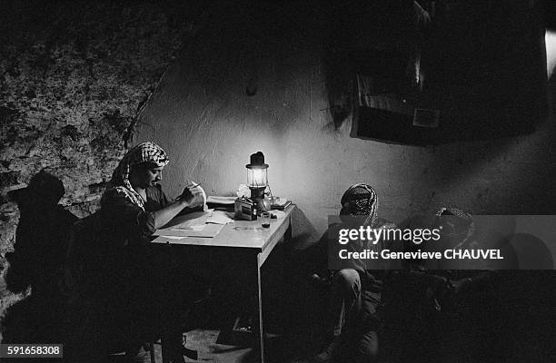 Yasser Arafat with Fedayin fighters of the Fatah movement inside the cave that he used as a hiding place during his exile in Jordania.