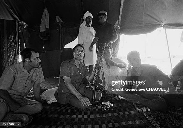 Libyan Leader Muammar al-Qaddafi and followers in a tent in the Syrtes Desert, Libya.