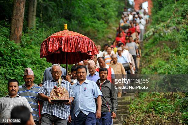 Devotees carrying the idol Bagh Bhairab for the celebration on the occasion of the Bagh Bhairab festival celebrated at Kirtipur, Kathmandu, Nepal on...