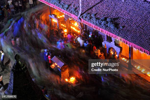 Devotees pictured as they circumambulate Bagh Bhairab temple on the occasion of the Bagh Bhairab festival celebrated at Kirtipur, Kathmandu, Nepal on...