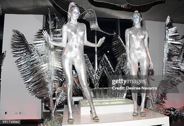 Models wearing body paint pose during W Hotels' party to celebrate the opening of W Dubai at The Glasshouses on August 17, 2016 in New York City.