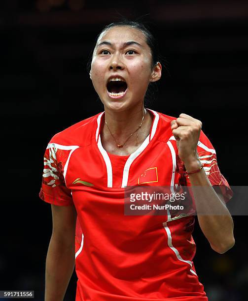 China's Wang Yihan celebrates scoring against India's Pusarla V. Sindhu during the women's singles quarterfinal of Badminton at the 2016 Rio Olympic...