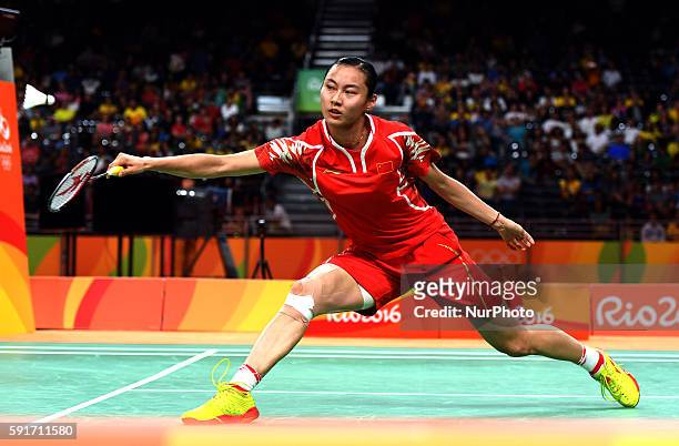 China's Wang Yihan competes during the women's singles quarterfinal of Badminton against India's Pusarla V. Sindhu at the 2016 Rio Olympic Games in...