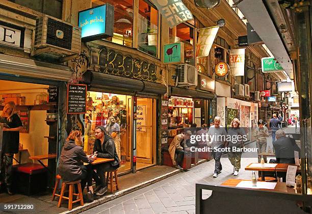 People sit in a cafe on Degraves Street, one of Melbourne's iconic laneways on August 18, 2016 in Melbourne, Australia. Melbourne has been named as...