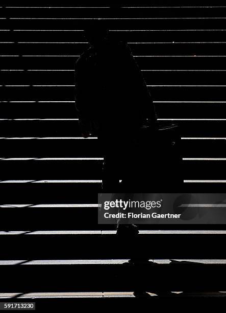The silhouette of a traveler is captured in front of stairs on April 01, 2015 in Frankfurt on the Main, Germany.