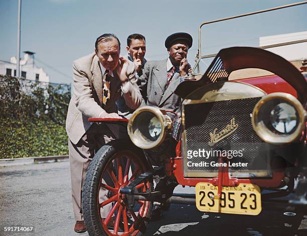 Portrait of, from left, American actor and comedian Jack Benny , entertainer Frank Sinatra , and actor and comedian Eddie 'Rochester' Anderson as...