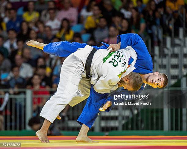 Karl-Richard Frey of Germany throws Miklos Cirjenics of Hungary for an ippon in extra time to win their u100kg contest during day 6 of the 2016 Rio...