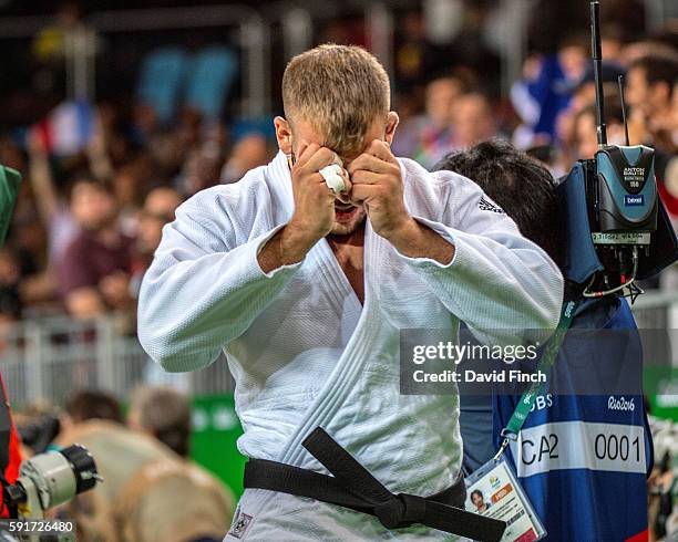 Karl-Richard Frey of Germany leaves the mat in tears after losing u100kg bronze medal contest Cyrille Maret of France during day 6 of the 2016 Rio...