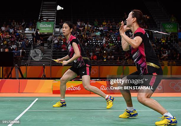 South Korea's Jung Kyung Eun and South Korea's Shin Seung Chan returns against China's Tang Yuanting and China's Yu Yang during their women's doubles...