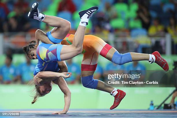Day 12 Vinesh Vinesh of India throws Emilia Alina Vuc of Romania during their Women's Freestyle 48 kg bout at the Carioca Arena 2 on August 17, 2016...
