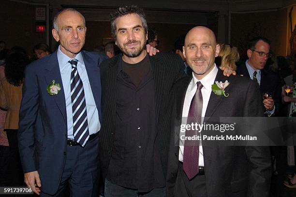 Kevin McCormick, Alfonso Cuaron and Jeff Robinov attend Jeff Robinov and Kevin McCormick of Warner Bros., with Maria Campbell host a Cocktail...