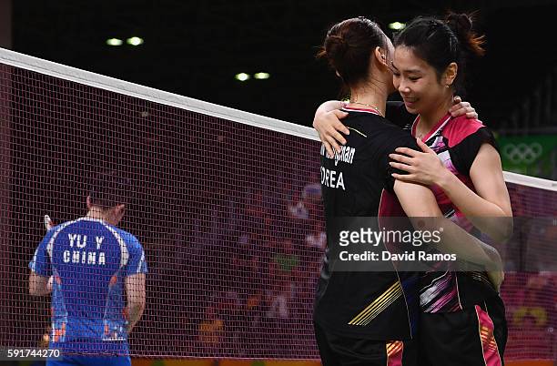 Kyung Eun Jung and Seung Chan Shin of Republic of Korea celebrate defeating Yu Yang and Yuanting Tang of China during the Women's Badminton Double...