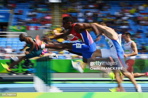 Cuba's Leonel Suarez competes in the Men's Decathlon 110m Hurdles during the athletics event at the Rio 2016 Olympic Games at the Olympic Stadium in...
