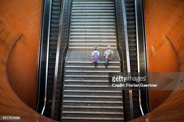 Two persons go upstairs from an underpass on August 17, 2016 in Berlin, Germany.