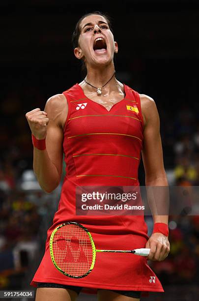 Carolina Marin of Spain celebrates winning a point against Xuerui Li of China during the Women's Badminton Singles Semifinal Match between Carolina...