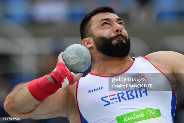 Serbia's Asmir Kolasinac competes in the Men's Shot Put Qualifying Round during the athletics event at the Rio 2016 Olympic Games at the Olympic...