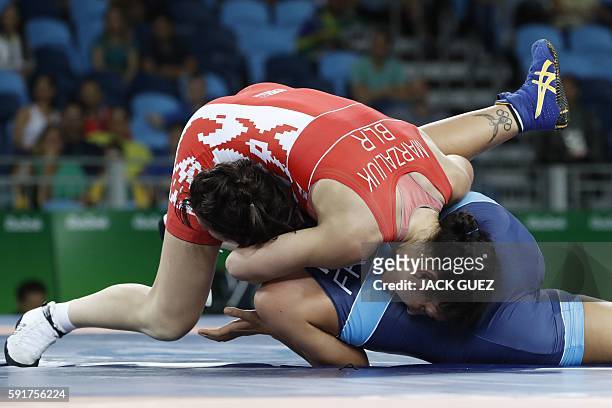 Belarus' Vasilisa Marzaliuk competes with France's Cynthia Vanessa Vescan during the women's wrestling 75kg qualifications at the Rio 2016 Olympic...