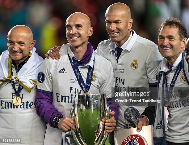 Fitness Coach Antonio Pintus, Assistant Coach David Bettani, Zinedine Zidane, Keeper Coach Luis LLopis celebrate with the trophy after theUEFA Super...