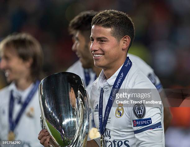James Rodriguez of Real Madrid celebrate with the trophy after theUEFA Super Cup match between Real Madrid and Sevilla at the Lerkendal Stadion on...