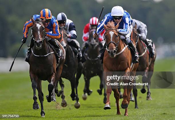 Jamie Spencer riding Queen Kindly win The Sky Bet Lowther Stakes from Roly Poly at York racecourse on August 18, 2016 in York, England.