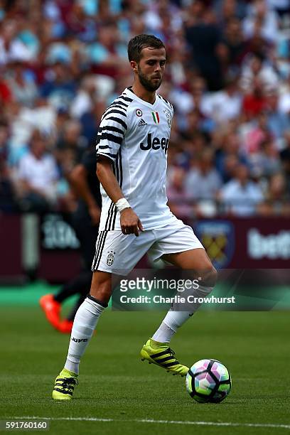 Miralem Pjanic of Juventus in action during the Pre-Season Friendly between West Ham United and Juventus at The Olympic Stadium on August 7, 2016 in...