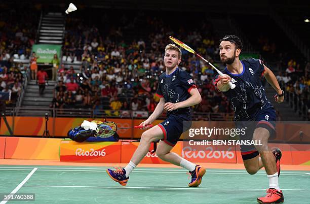 Great Britain's Marcus Ellis and Great Britain's Chris Langridge returns against China's Chai Biao and China's Hong Wei during their men's doubles...