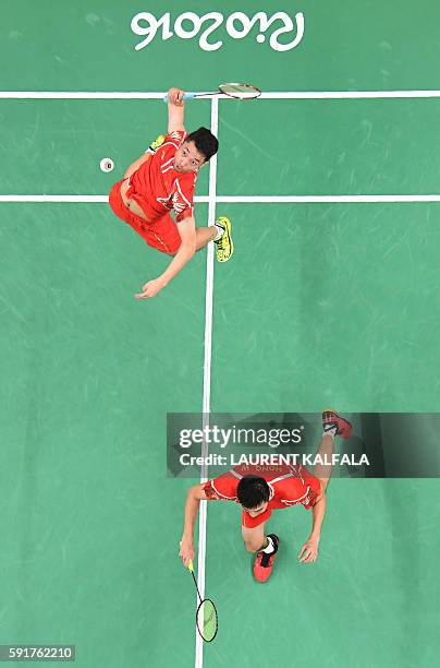 An overview shows China's Chai Biao and China's Hong Wei returns against Great Britain's Marcus Ellis and Great Britain's Chris Langridge during...