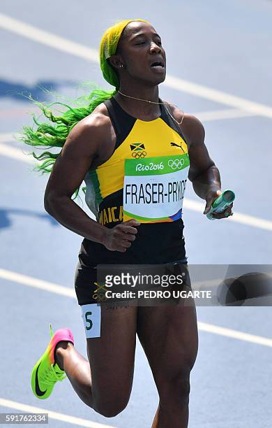 Jamaica's Shelly-Ann Fraser-Pryce competes in the Women's 4 x 100m Relay Round 1 during the athletics event at the Rio 2016 Olympic Games at the...