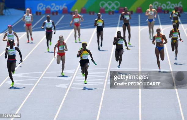 Britain's Daryll Neita, China's Liang Xiaojing, Jamaica's Shelly-Ann Fraser-Pryce, Canada's Khamica Bingham, Netherlands' Naomi Sedney and Ghana's...