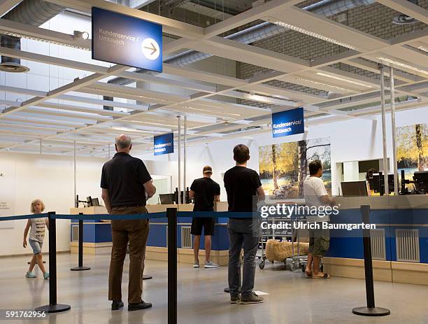 Filiale of the Swedish furniture house IKEA in Cologne. Customers at the counter for service and exchange.