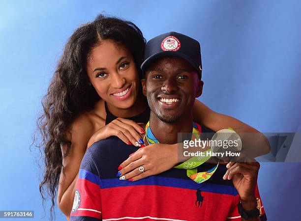 Track and field athlete, Will Claye of the United States poses for a photo with his finance Queen Harrison and his silver medal on the Today show set...