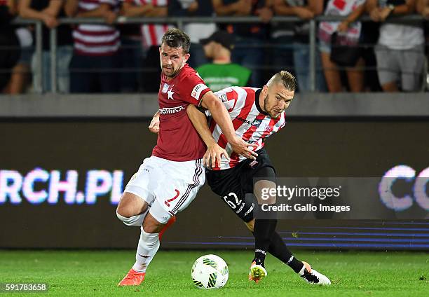 Rafal Pietrzak of Wisla and Erik Jendrisek of Cracovia during the LOTTO Extraklasa match between Cracovia and Wisla Krakow at Cracovia Stadium on...