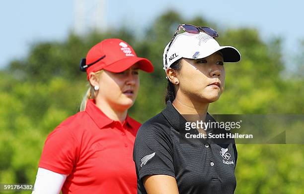 Lydia Ko of New Zealand and Charley Hull of Great Britain walk together on the fifth hole during the second round of the Women's Individual Stroke...