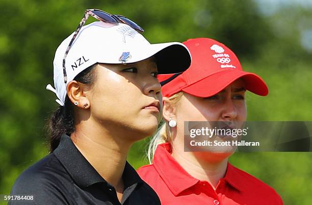 Lydia Ko of New Zealand and Charley Hull of Great Britain walk together on the fifth hole during the second round of the Women's Individual Stroke...