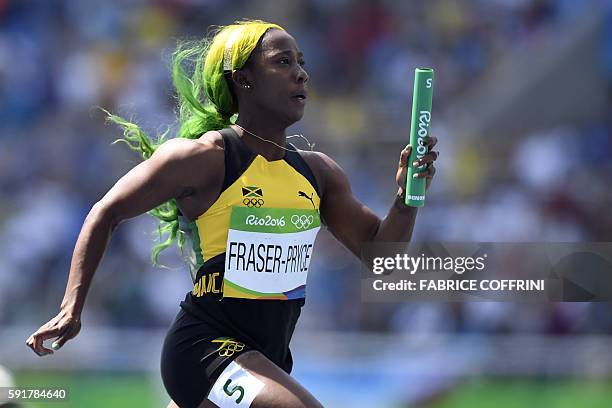 Jamaica's Shelly-Ann Fraser-Pryce competes in the Women's 4 x 100m Relay Round 1 during the athletics event at the Rio 2016 Olympic Games at the...