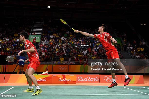 Wei Hong and Biao Chai of China plays a shot against Chris Langridge and Marcus Ellis of Great Britain during the Men's Doubles Badminton Bronze...