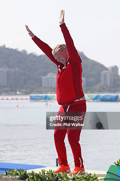 Silver medalist Emma Jorgensen of Denmark celebrates on the podium during the medal ceremony for the Women's Kayak Single 500m event at the Lagoa...