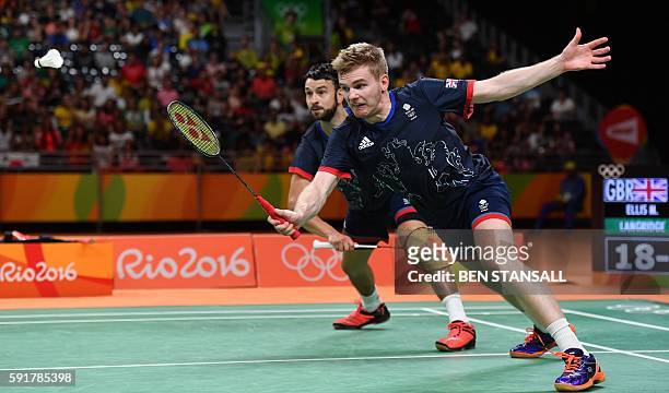Great Britain's Marcus Ellis and Great Britain's Chris Langridge return against China's Chai Biao and China's Hong Wei during their men's doubles...