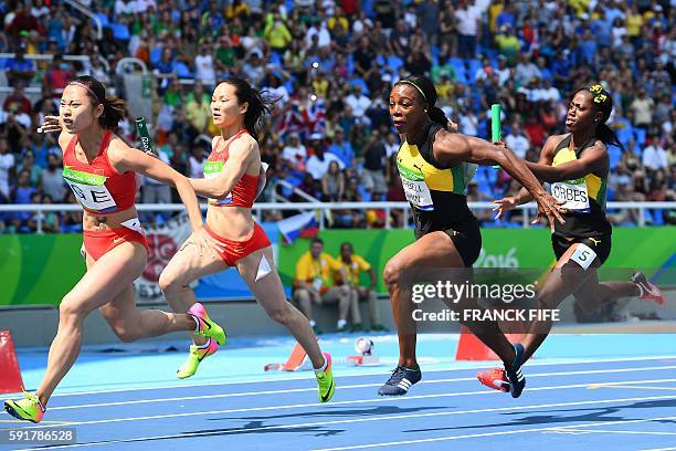 China's Ge Manqi, China's Wei Yongli, Jamaica's Veronica Campbell-Brown and Jamaica's Sashalee Forbes competes in the Women's 4 x 100m Relay Round 1...